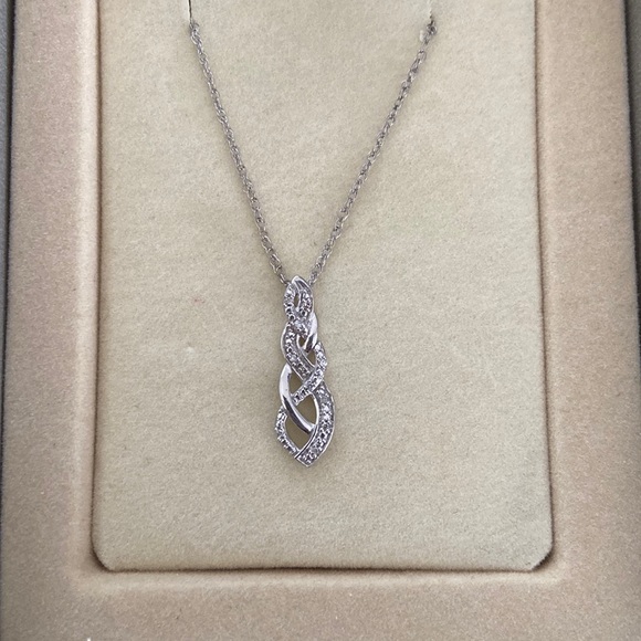 Sterling silver with diamond accent necklace and earrings. - Picture 2 of 3